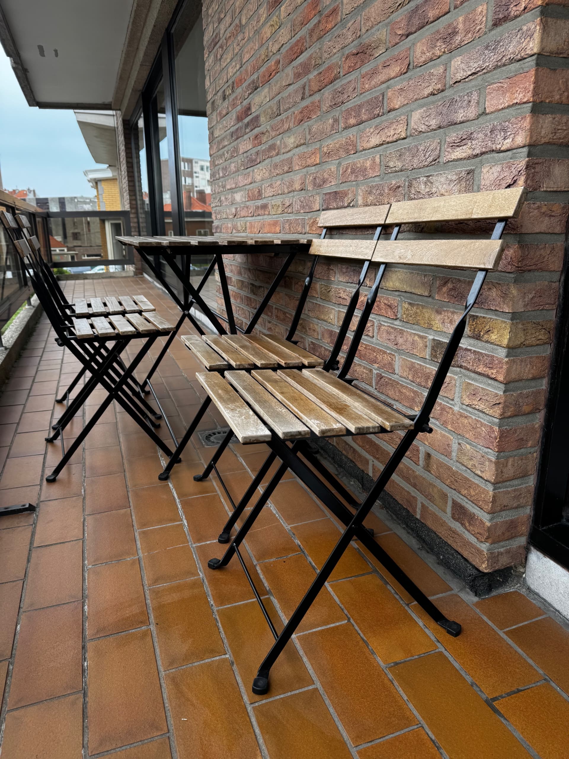 TÄRNÖ table+4 chairs, outdoor, black/light brown stained foldable/foldable Kuddarna light grey-beige, 100x54 cm