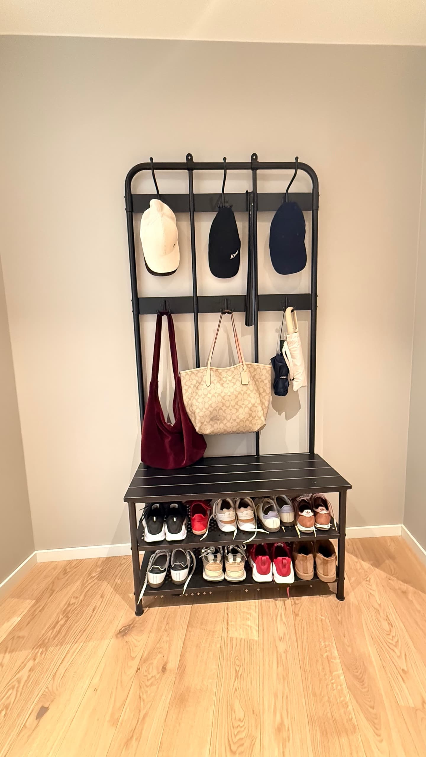 NIPÅSEN coat rack and bench w shoe storage, black, 190x35x79 cm