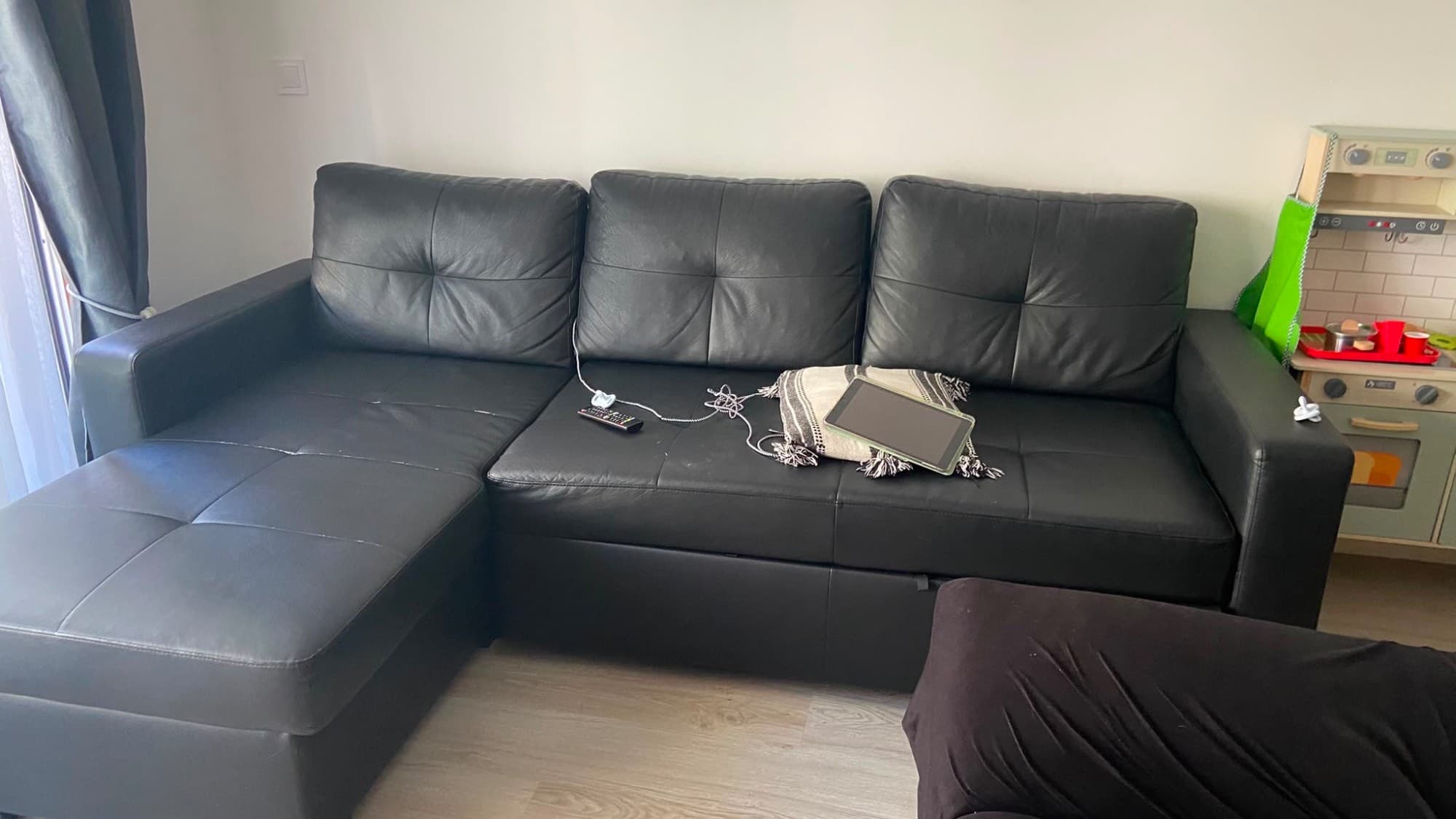 RAGUNDA corner sofa-bed with storage, Bomstad black
