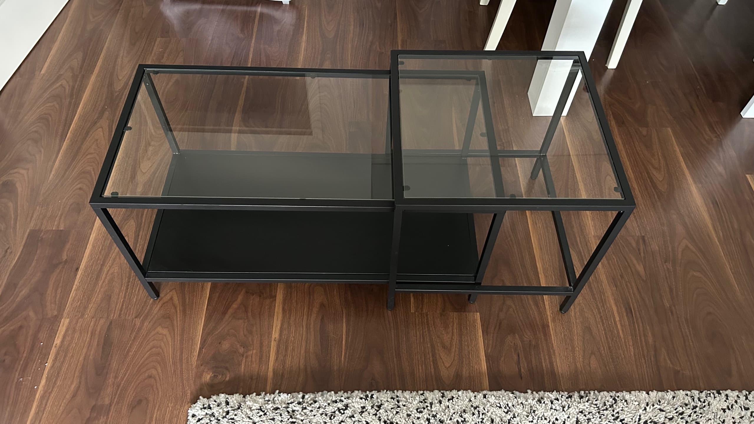 VITTSJÖ Nest of tables, set of 2, black-brown, glass, 90x50 cm