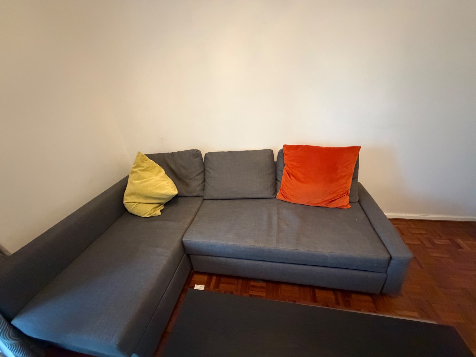 FRIHETEN corner sofa-bed with storage, with extra back cushions/Hyllie dark grey
