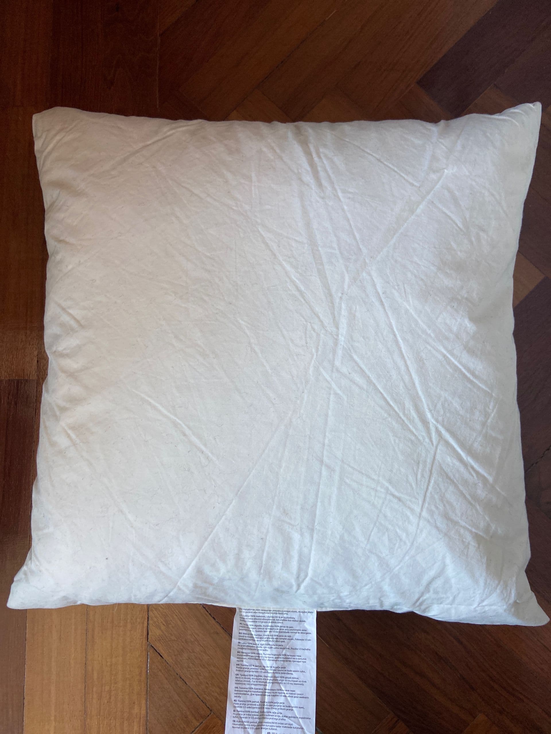 FJÄDRAR cushion pad, off-white, 50x50 cm